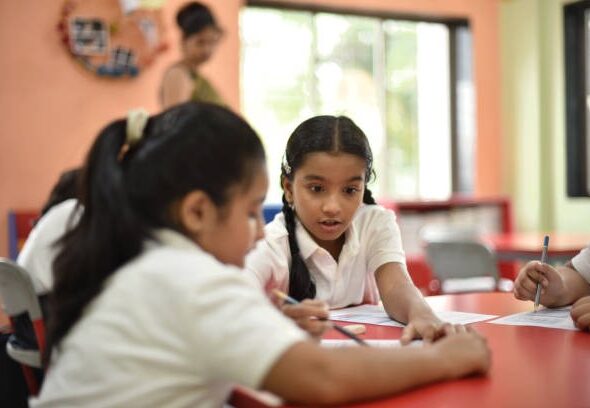 girl-student-helping-her-classma