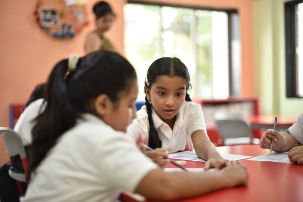 girl-student-helping-her-classma